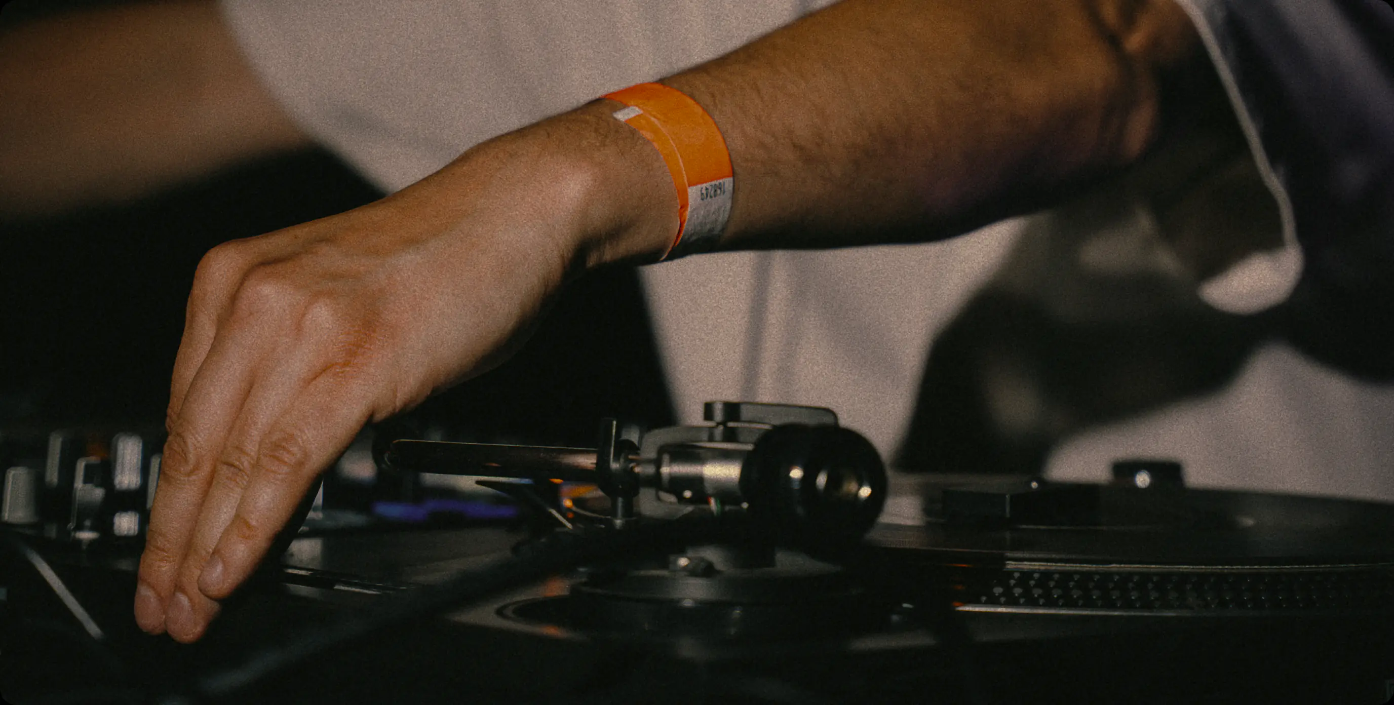 Close-up of a DJ's hand on a turntable